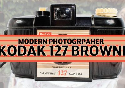 MODERN PHOTOGRAPHER TRIES 127 BROWNIE.